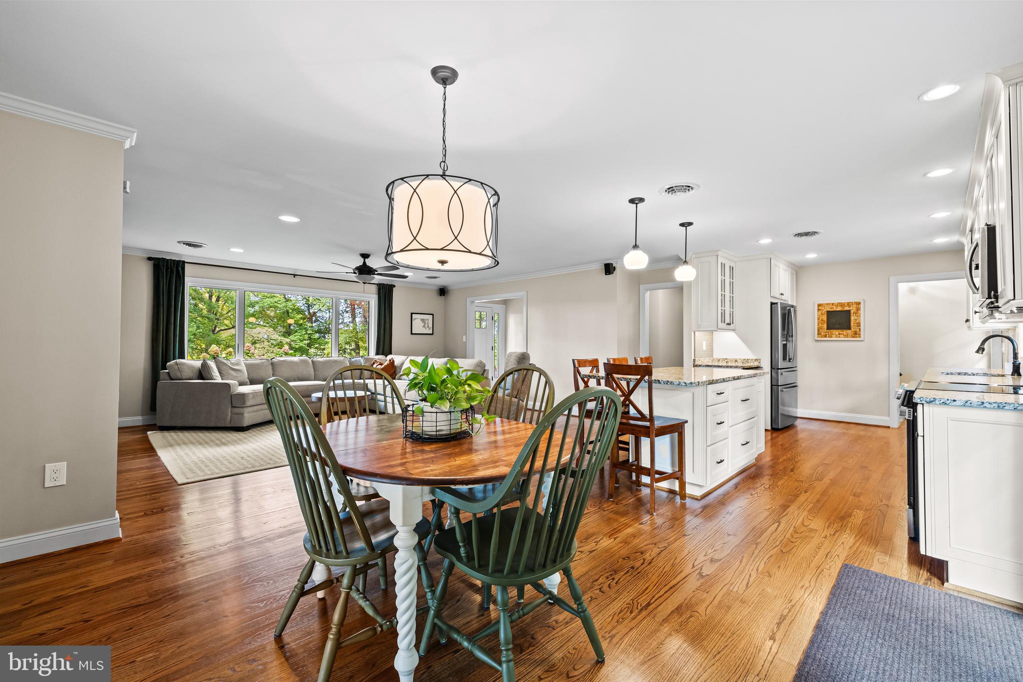 5507 Williams Road Hydes, MD 21082 - Photo 39 of 39 a view of a dining room and livingroom with furniture wooden floor a chandelier