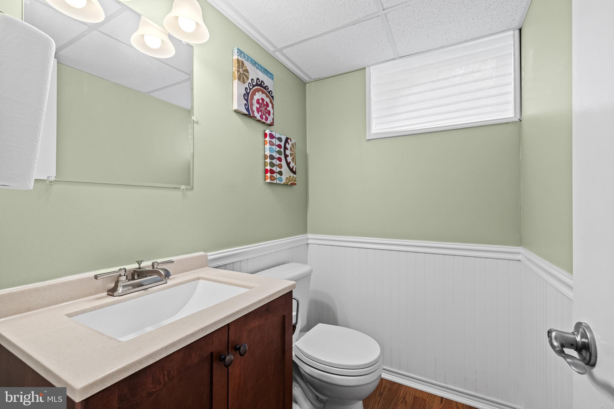 5507 Williams Road Hydes, MD 21082 - Photo 31 of 39 a bathroom with a sink mirror vanity and toilet