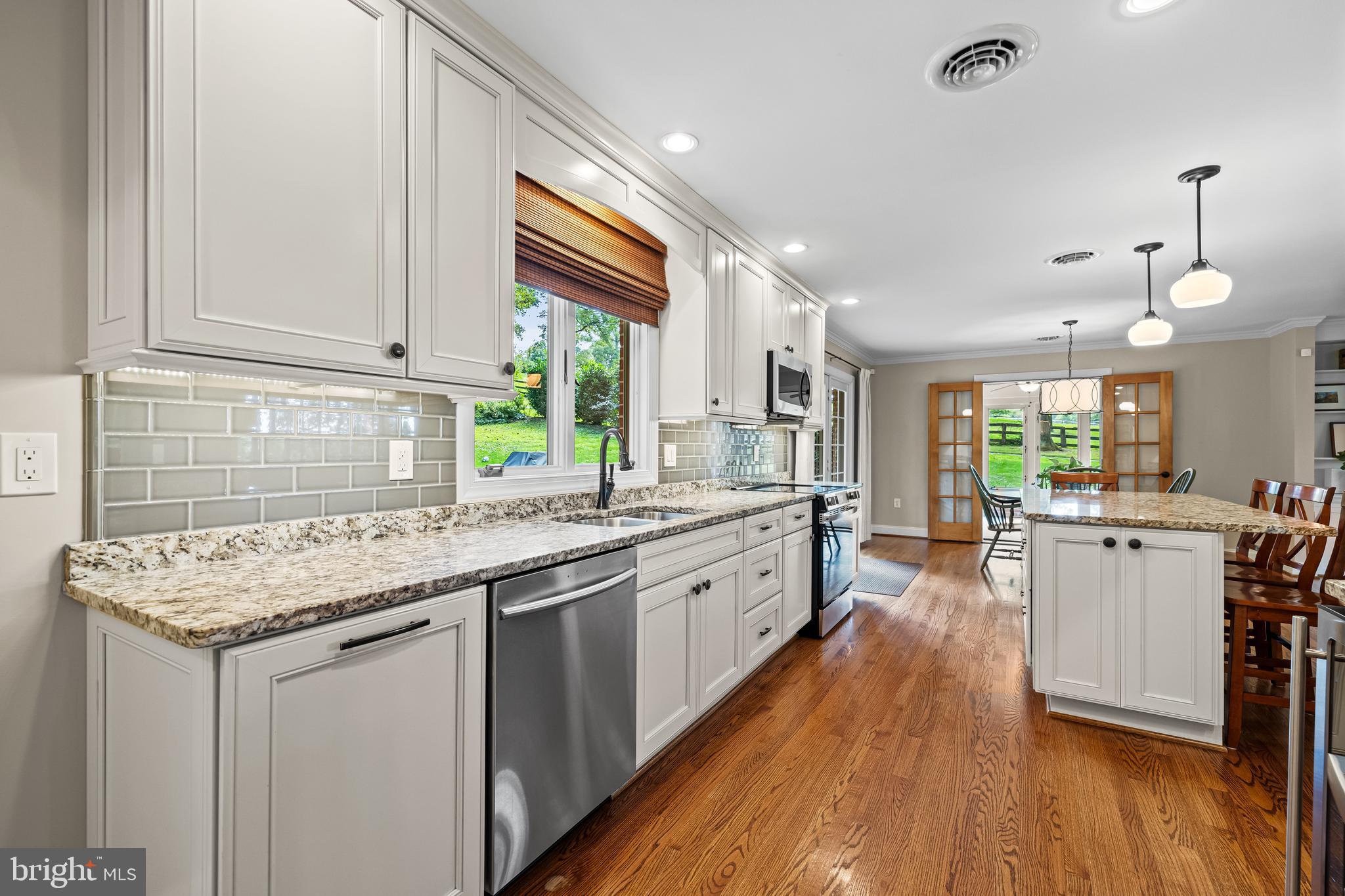 5507 Williams Road Hydes, MD 21082 - Photo 6 of 39 a kitchen with a sink stove and wooden cabinets