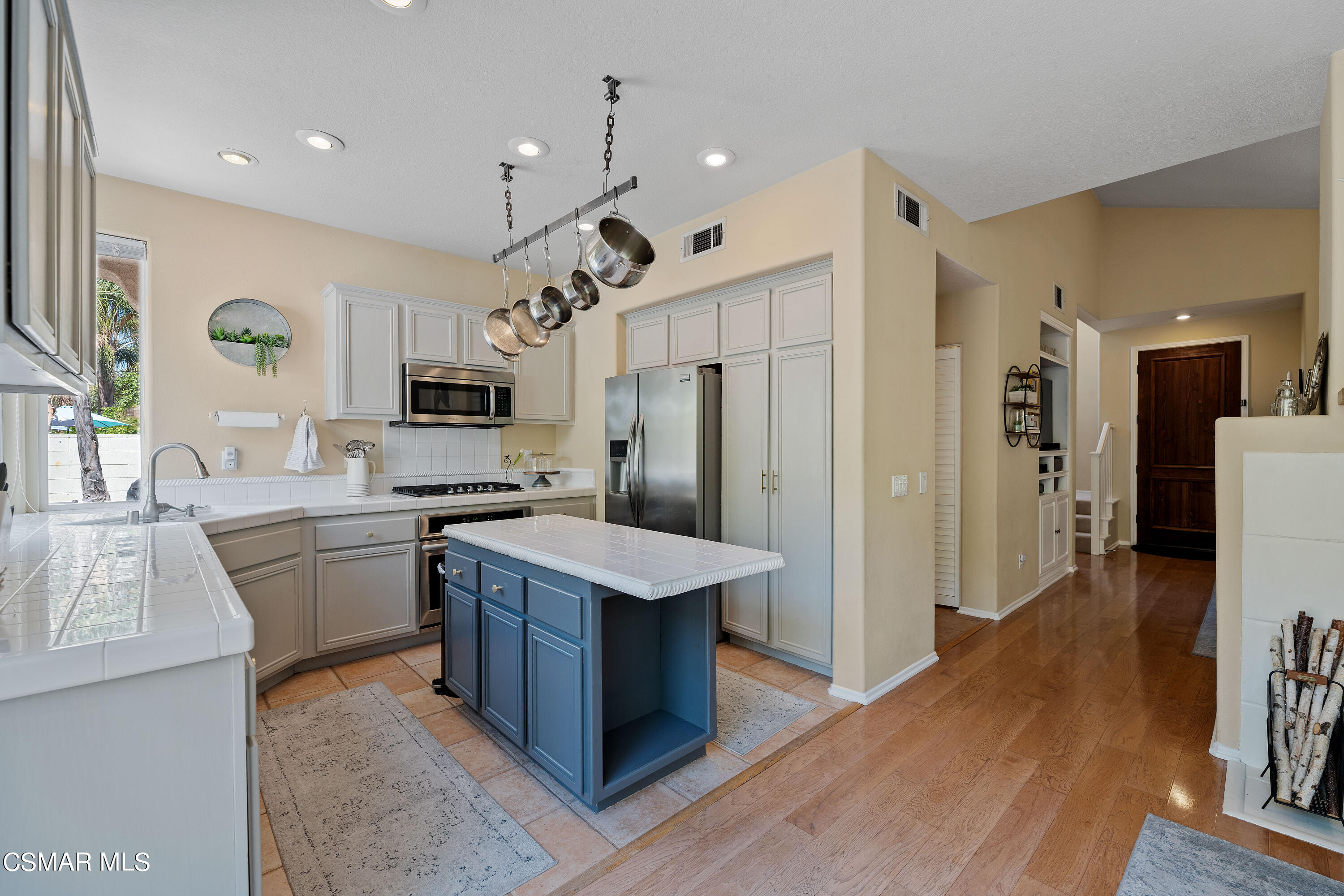 3902 Sarno Court Moorpark, CA 93021 - Photo 14 of 46 a kitchen with cabinets and stainless steel appliances