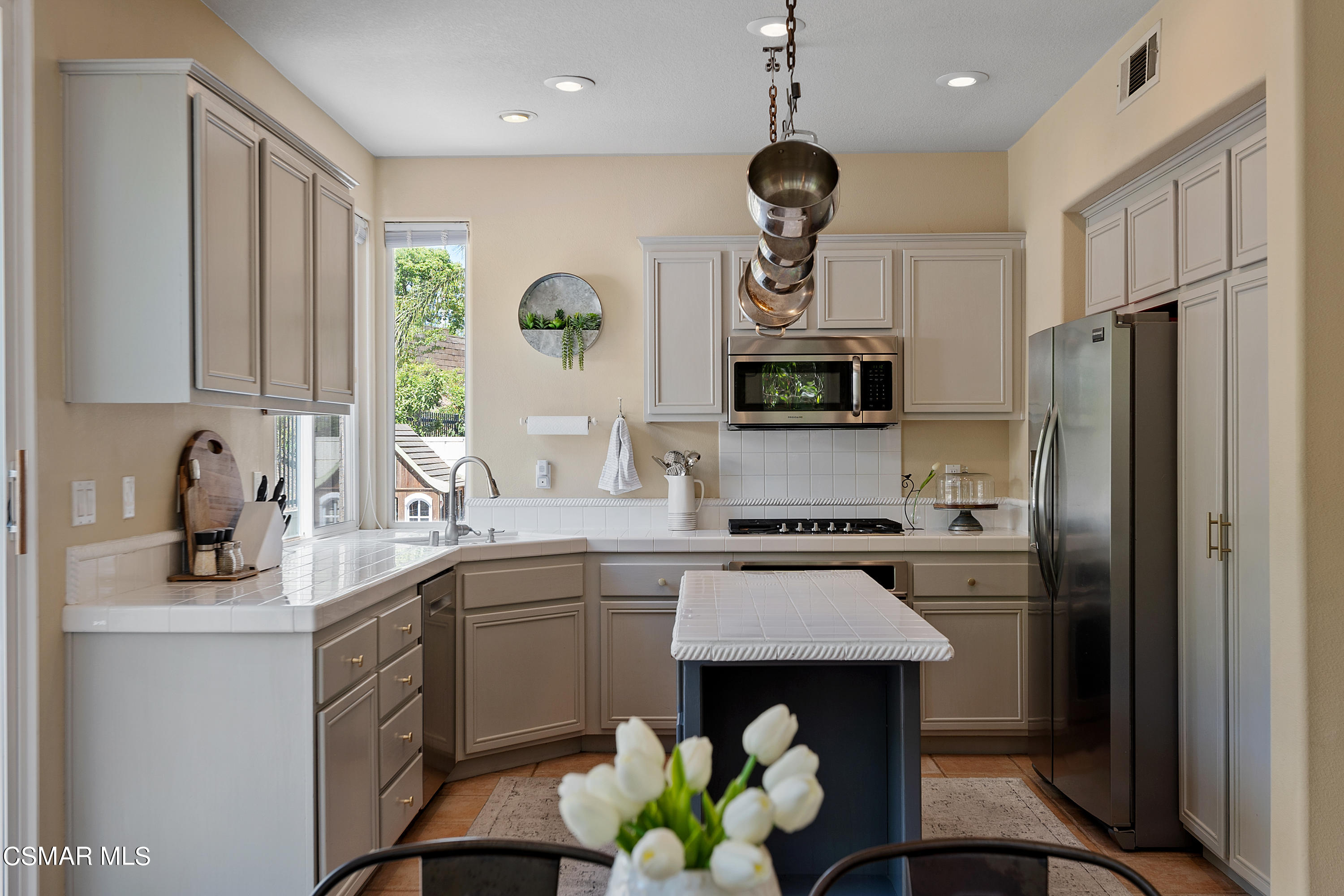 3902 Sarno Court Moorpark, CA 93021 - Photo 8 of 46 a kitchen with a sink stainless steel appliances and cabinets