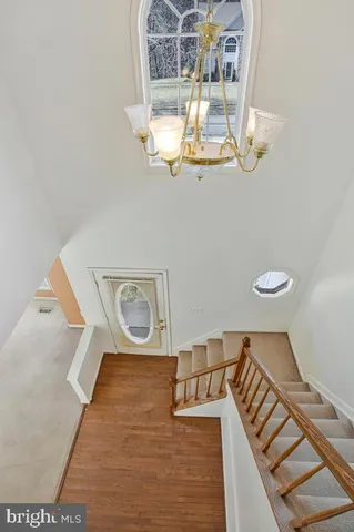 a view of water heater room with wooden floor