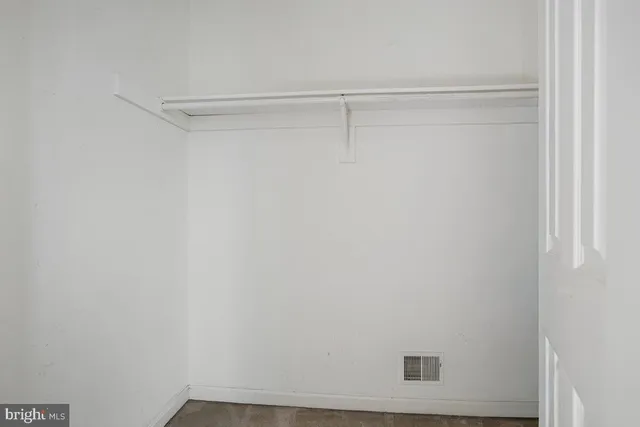 a view of a room with racks on the wall