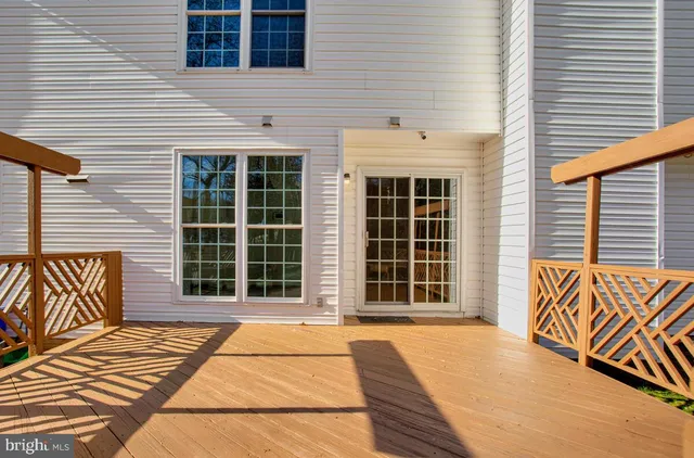 a view of a brick house with large windows