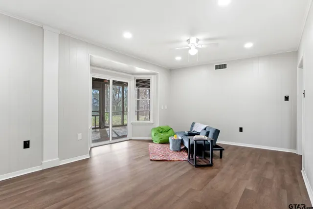 a room with furniture and wooden floor
