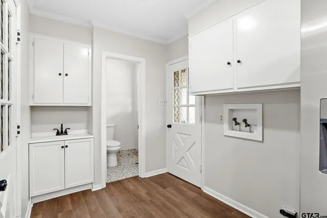 a view of an empty room and closet area