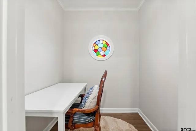 a workspace with furniture and a window