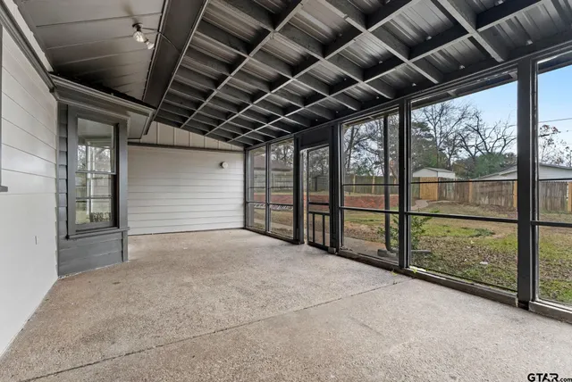 a view of porch with wooden floor