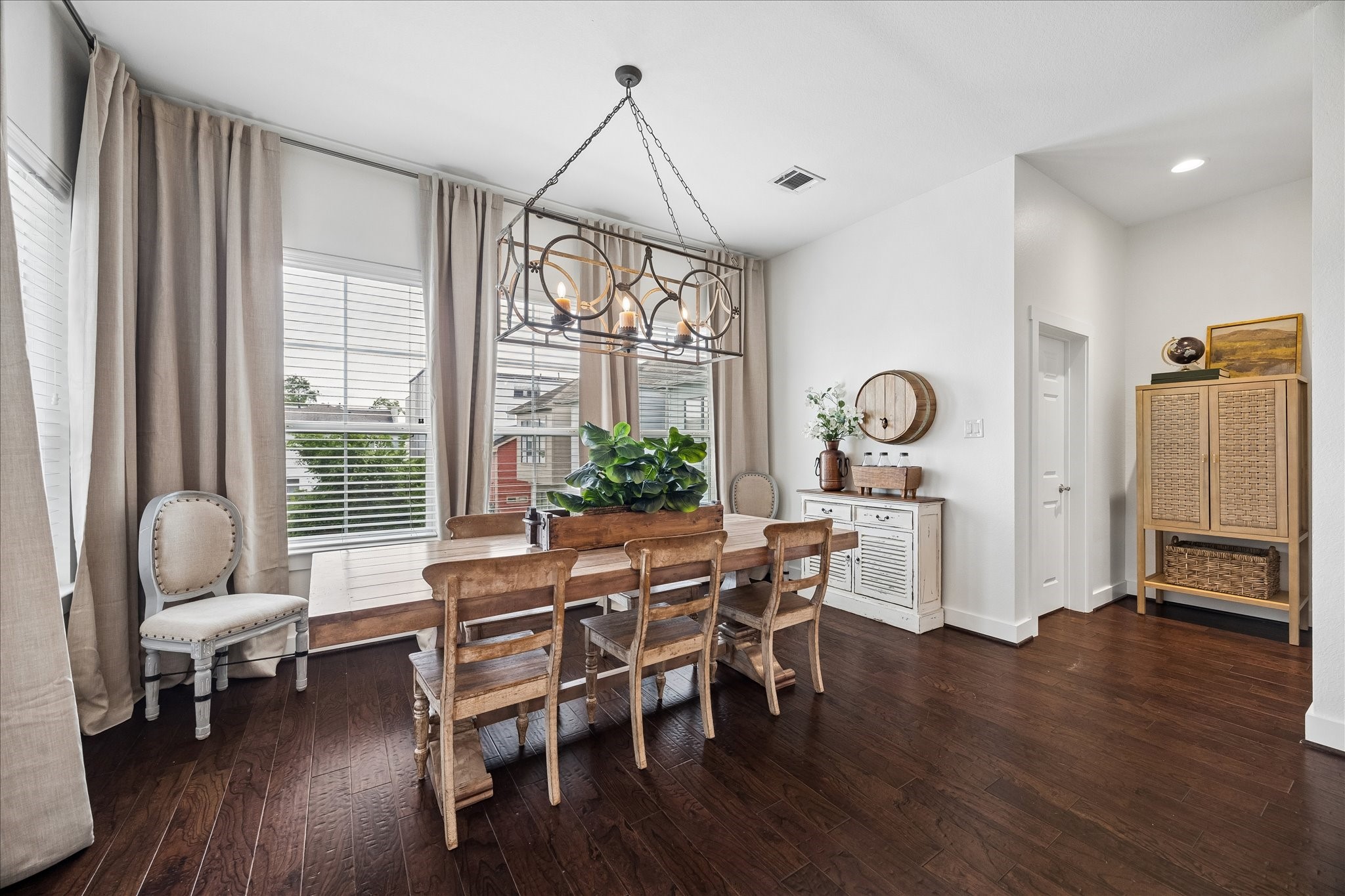 2416 Couch Street Houston, TX 77008 - Photo 22 of 34 a view of a dining room with furniture window and wooden floor