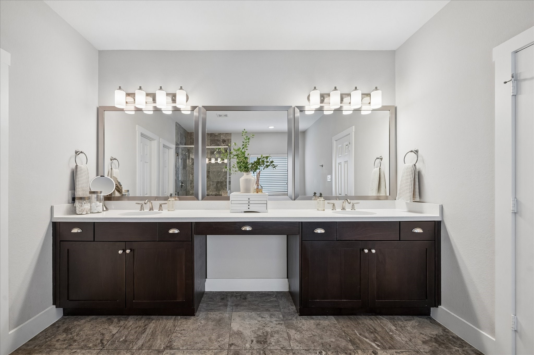 2416 Couch Street Houston, TX 77008 - Photo 28 of 34 a bathroom with a sink double vanity and a mirror