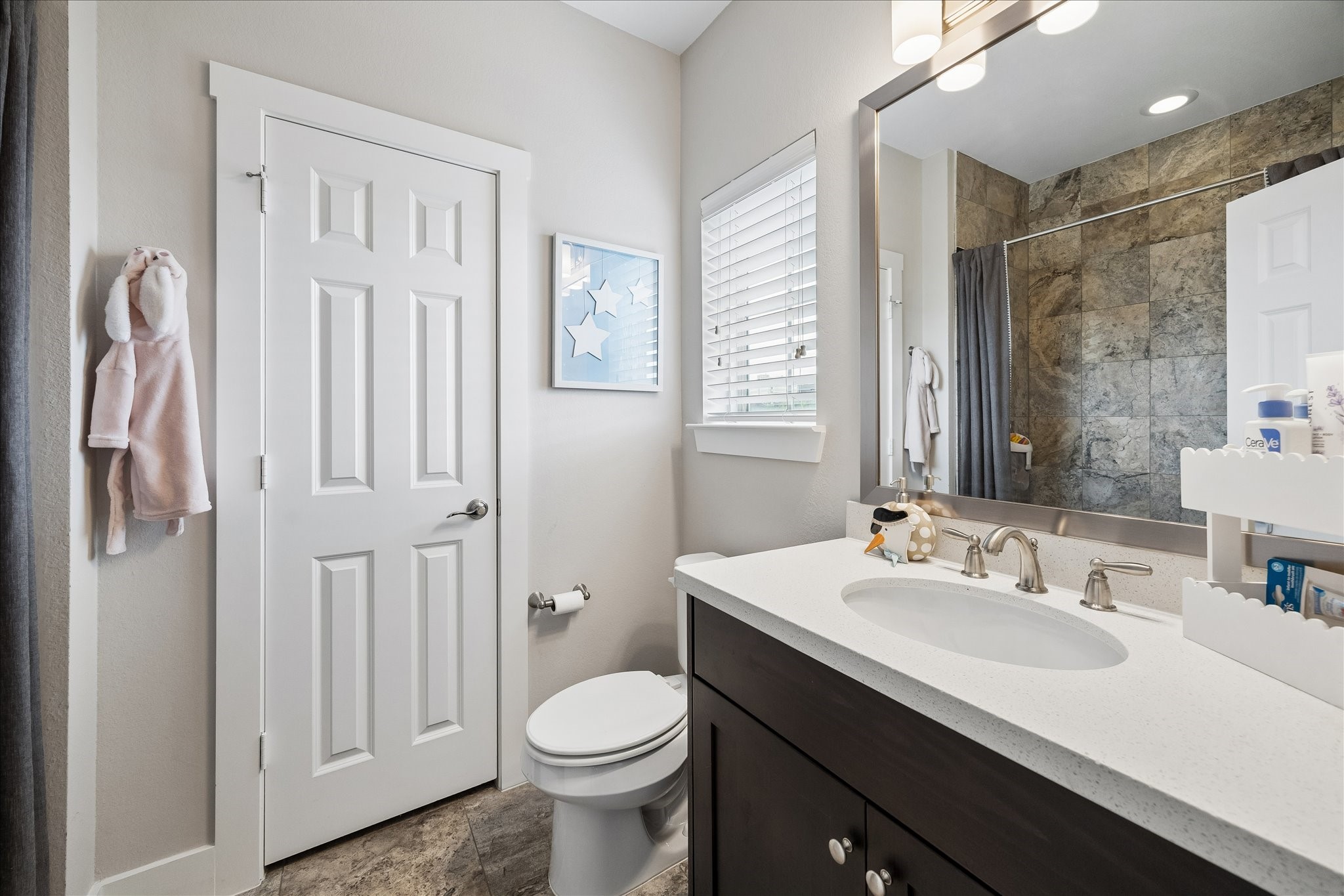 2416 Couch Street Houston, TX 77008 - Photo 31 of 34 a bathroom with a sink toilet and shower