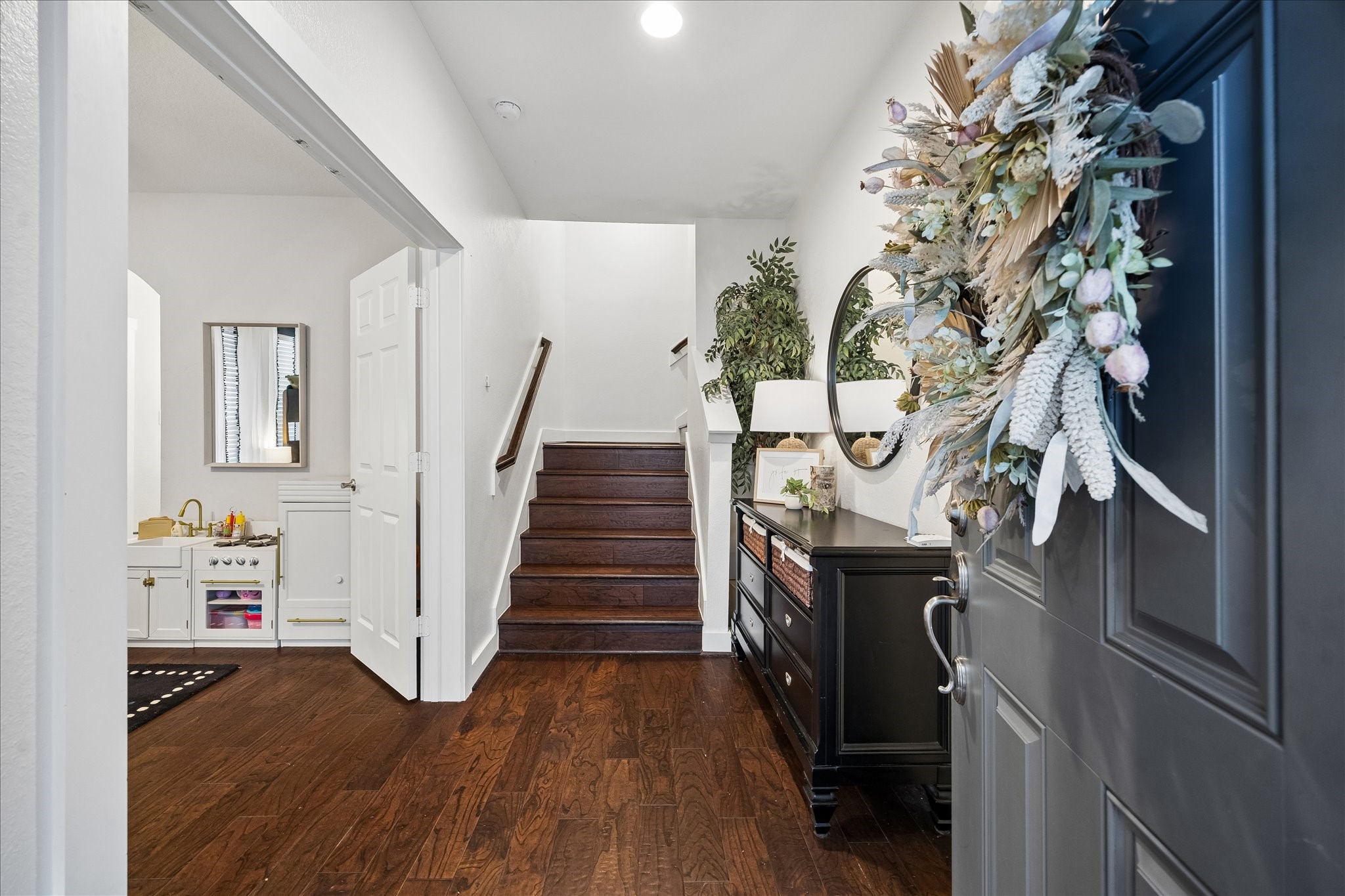 2416 Couch Street Houston, TX 77008 - Photo 10 of 34 a view of an entryway with wooden floor