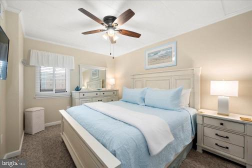 11 134th Street, Unit 205 Ocean City, MD 21842 - Photo 13 of 29 a spacious bedroom with a large bed and a chandelier