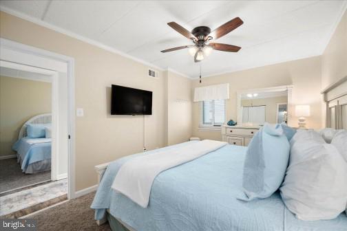 11 134th Street, Unit 205 Ocean City, MD 21842 - Photo 15 of 29 a bedroom with a bed and a flat screen tv