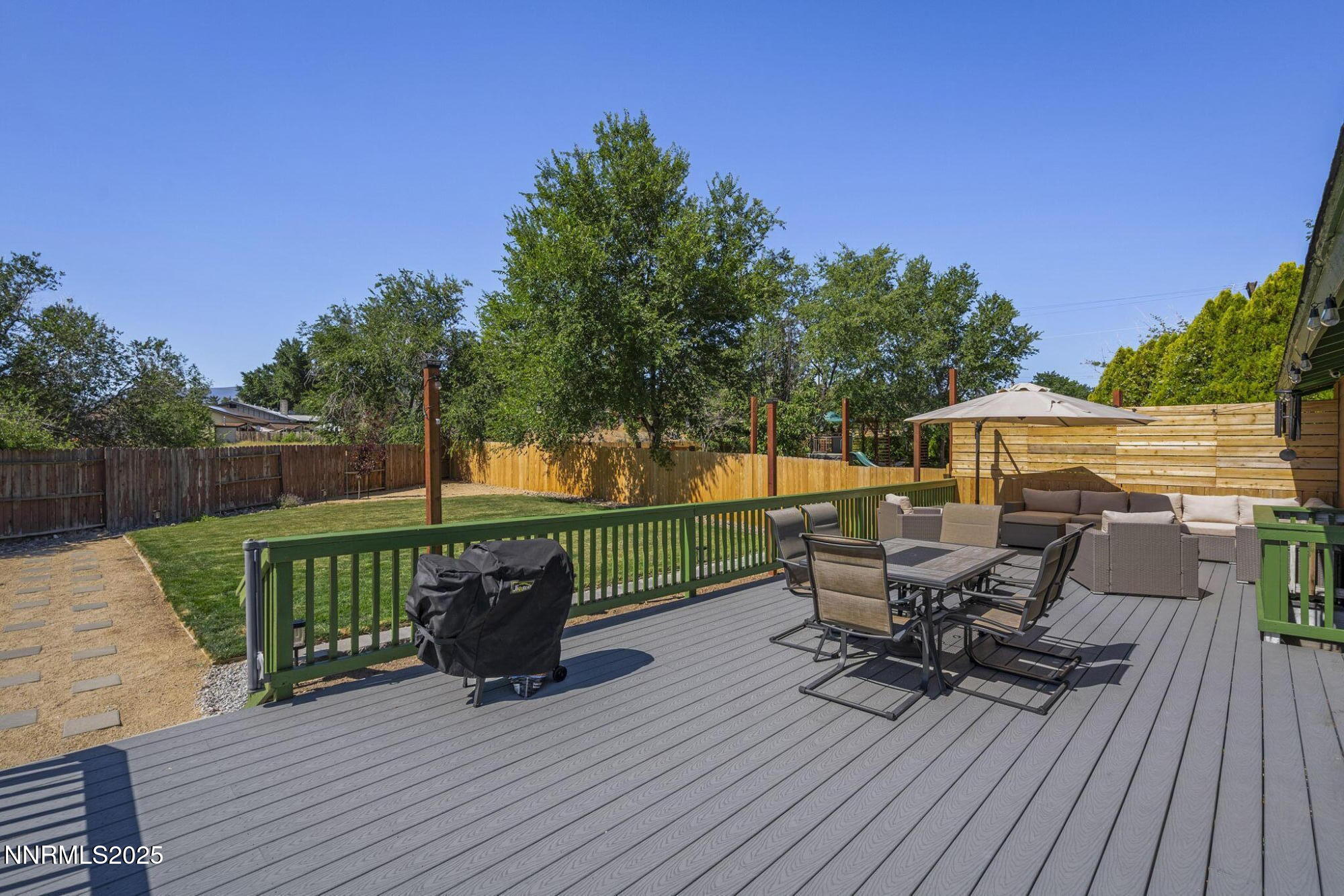 a view of a deck with furniture