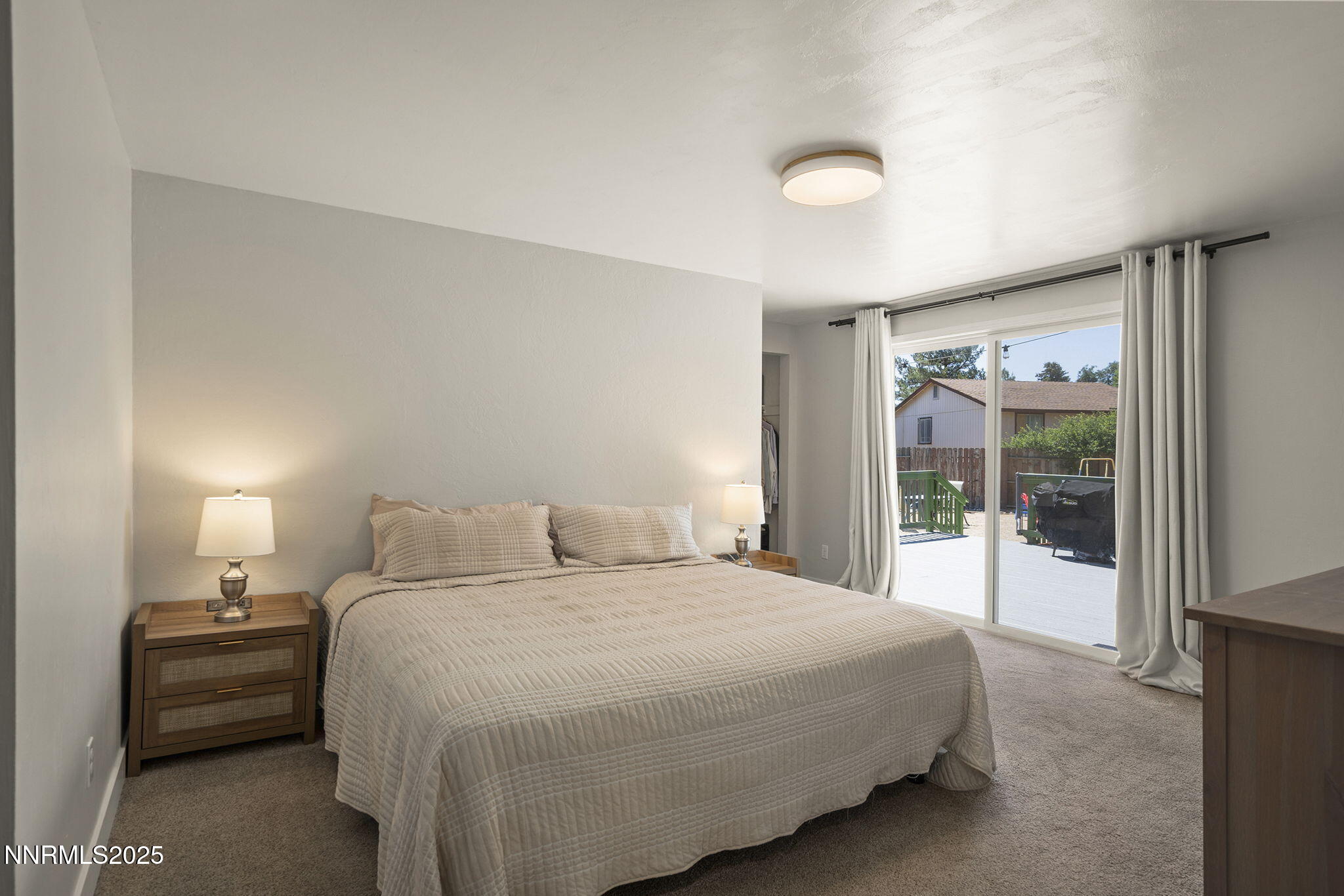 1080 Tudor Court Reno, NV 89503 - Photo 11 of 30 a bedroom with a large bed and a large window