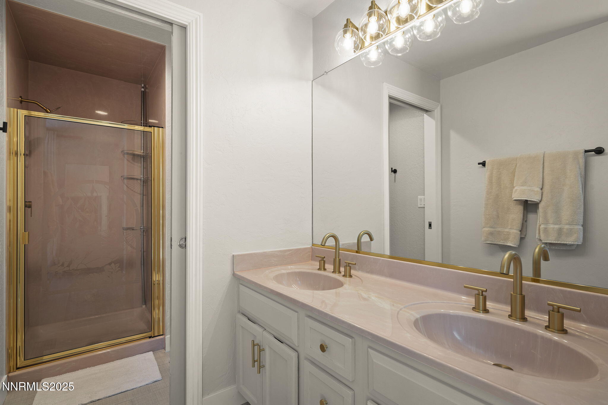 1080 Tudor Court Reno, NV 89503 - Photo 12 of 30 a bathroom with a sink double vanity and shower