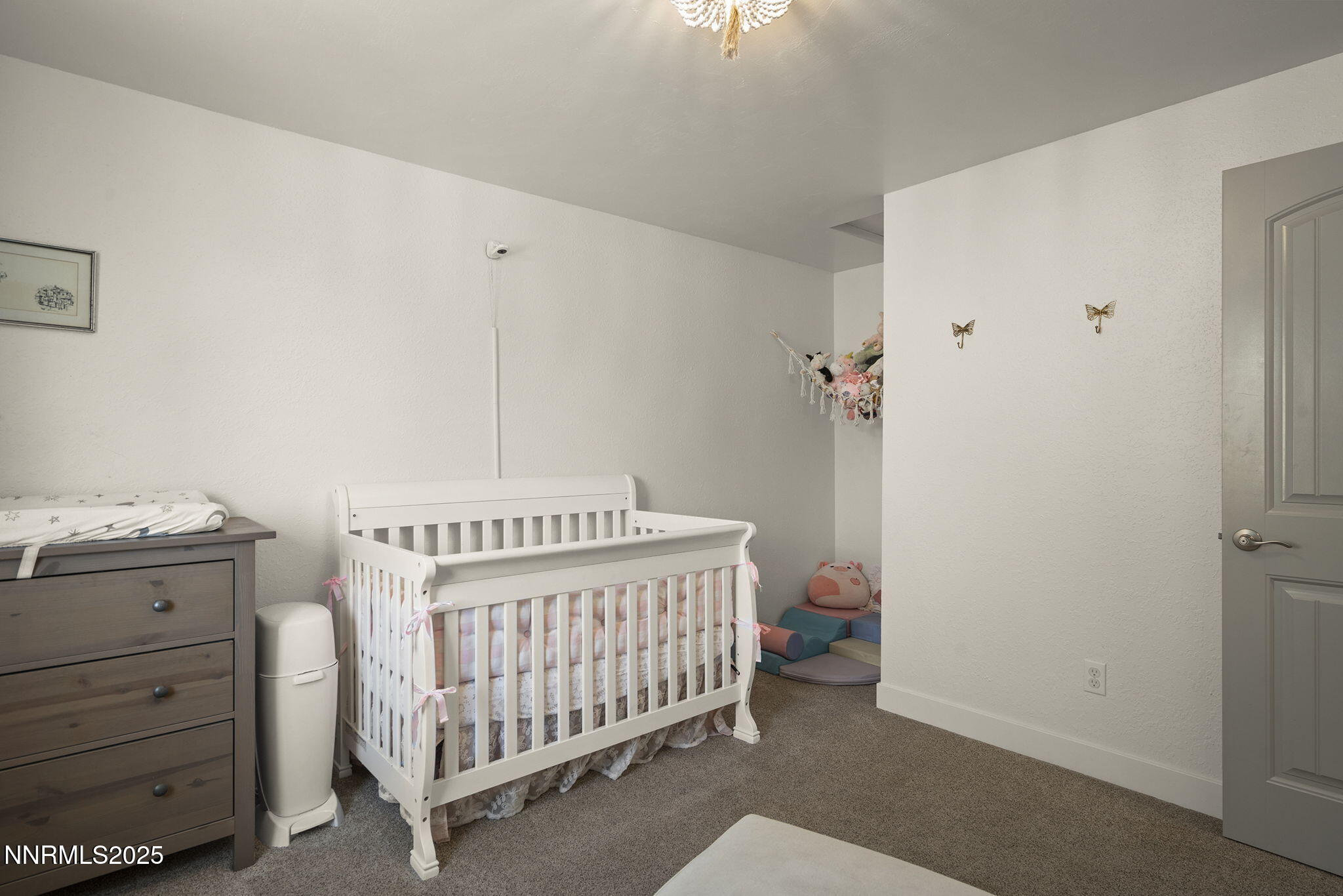 1080 Tudor Court Reno, NV 89503 - Photo 14 of 30 a bedroom with a bed and a dresser
