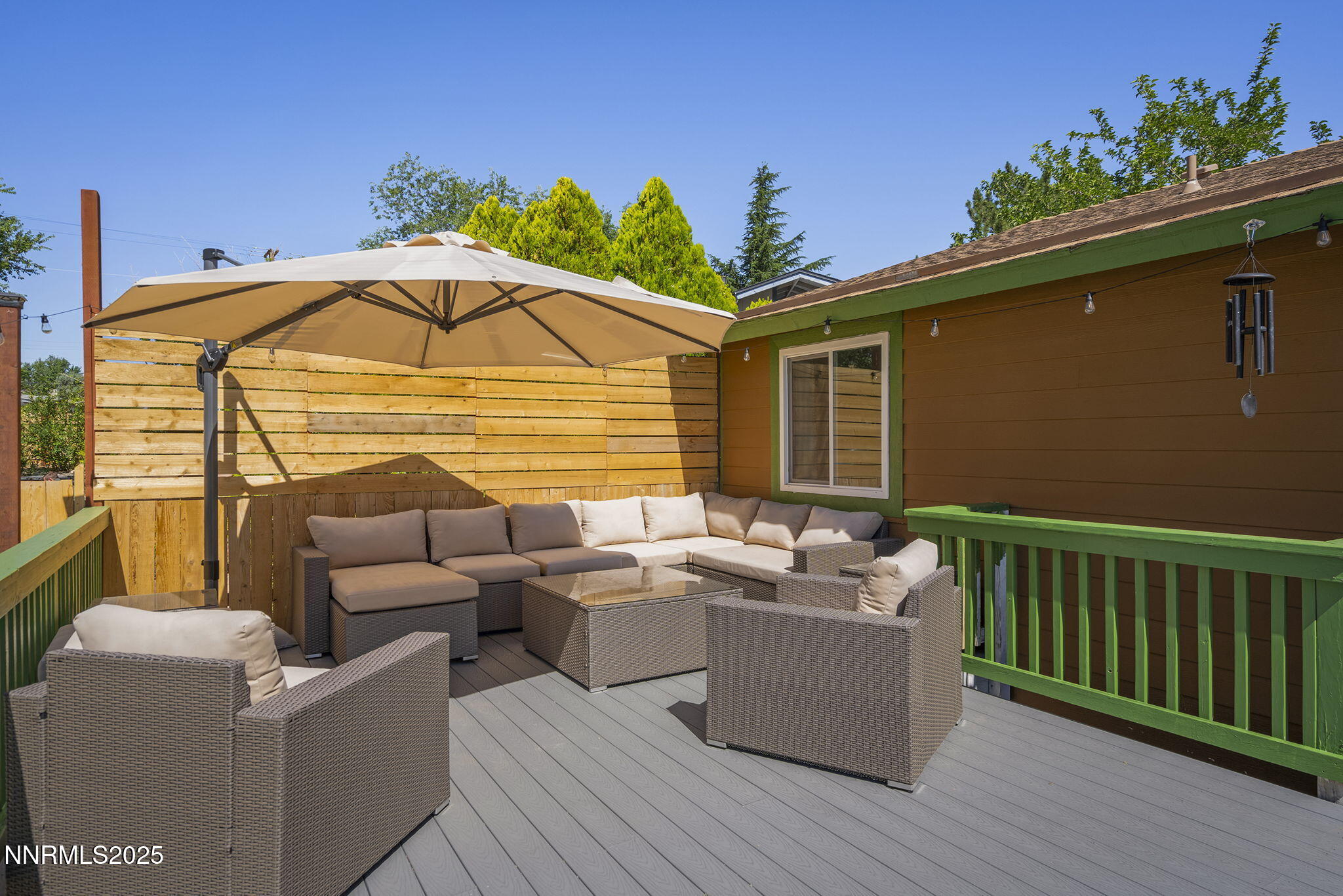 1080 Tudor Court Reno, NV 89503 - Photo 22 of 30 a view of a roof deck with couches under an umbrella