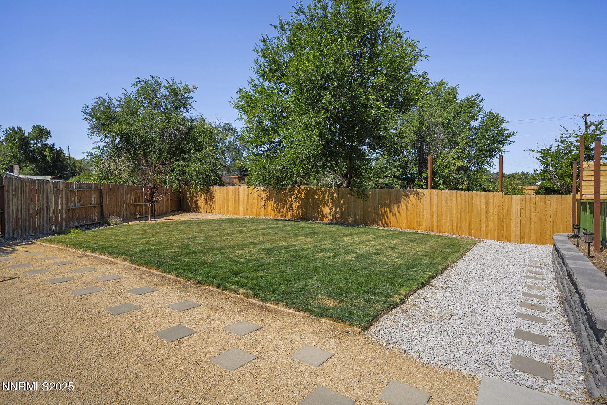 1080 Tudor Court Reno, NV 89503 - Photo 26 of 30 a view of a backyard with green space