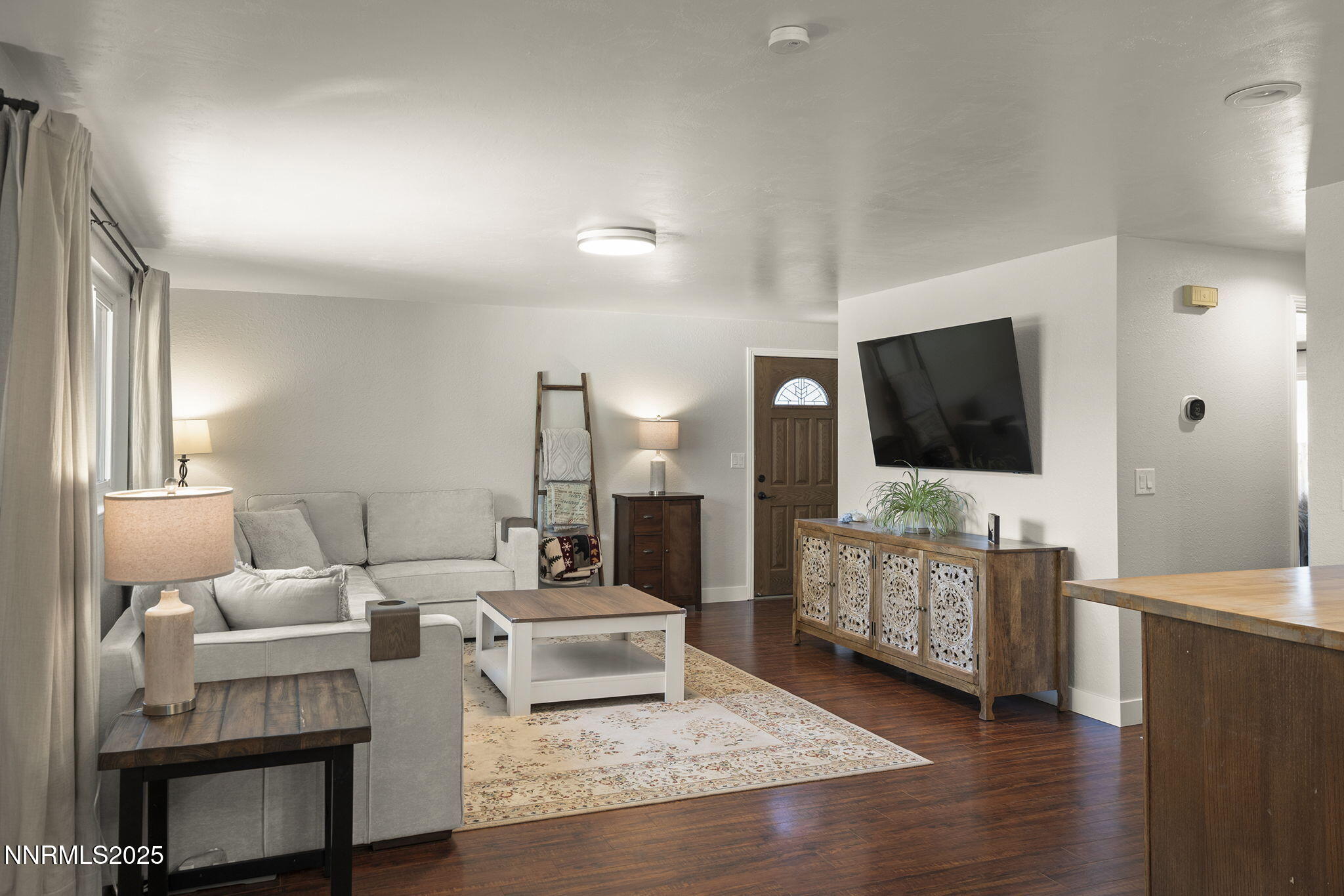 1080 Tudor Court Reno, NV 89503 - Photo 6 of 30 a living room with furniture and a flat screen tv