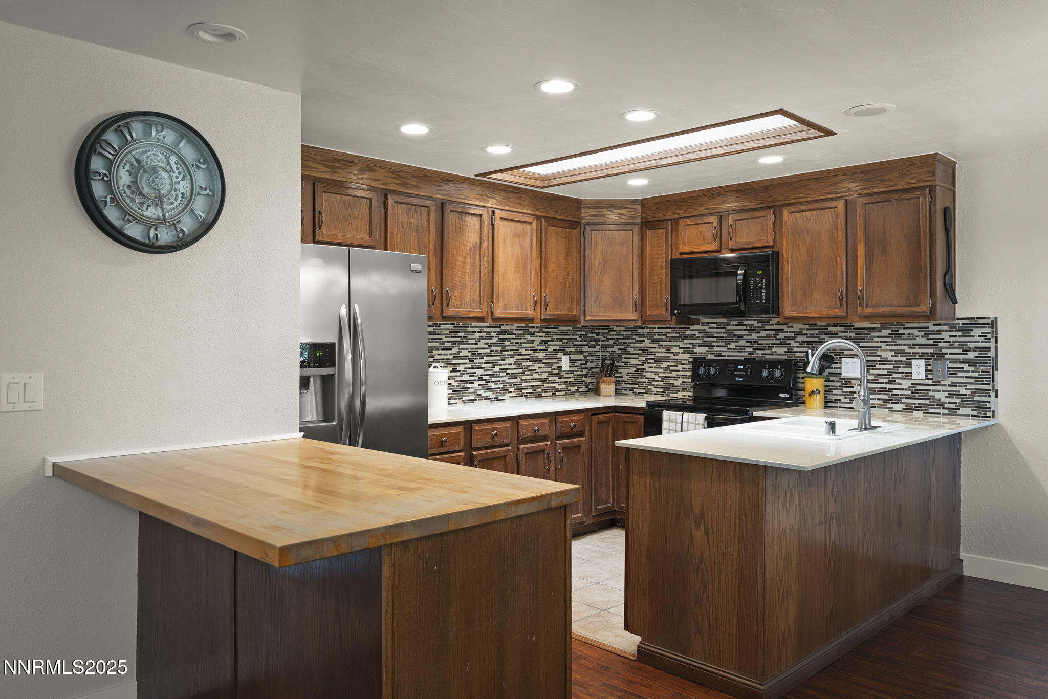 1080 Tudor Court Reno, NV 89503 - Photo 8 of 30 a kitchen with stainless steel appliances granite countertop a sink stove and refrigerator