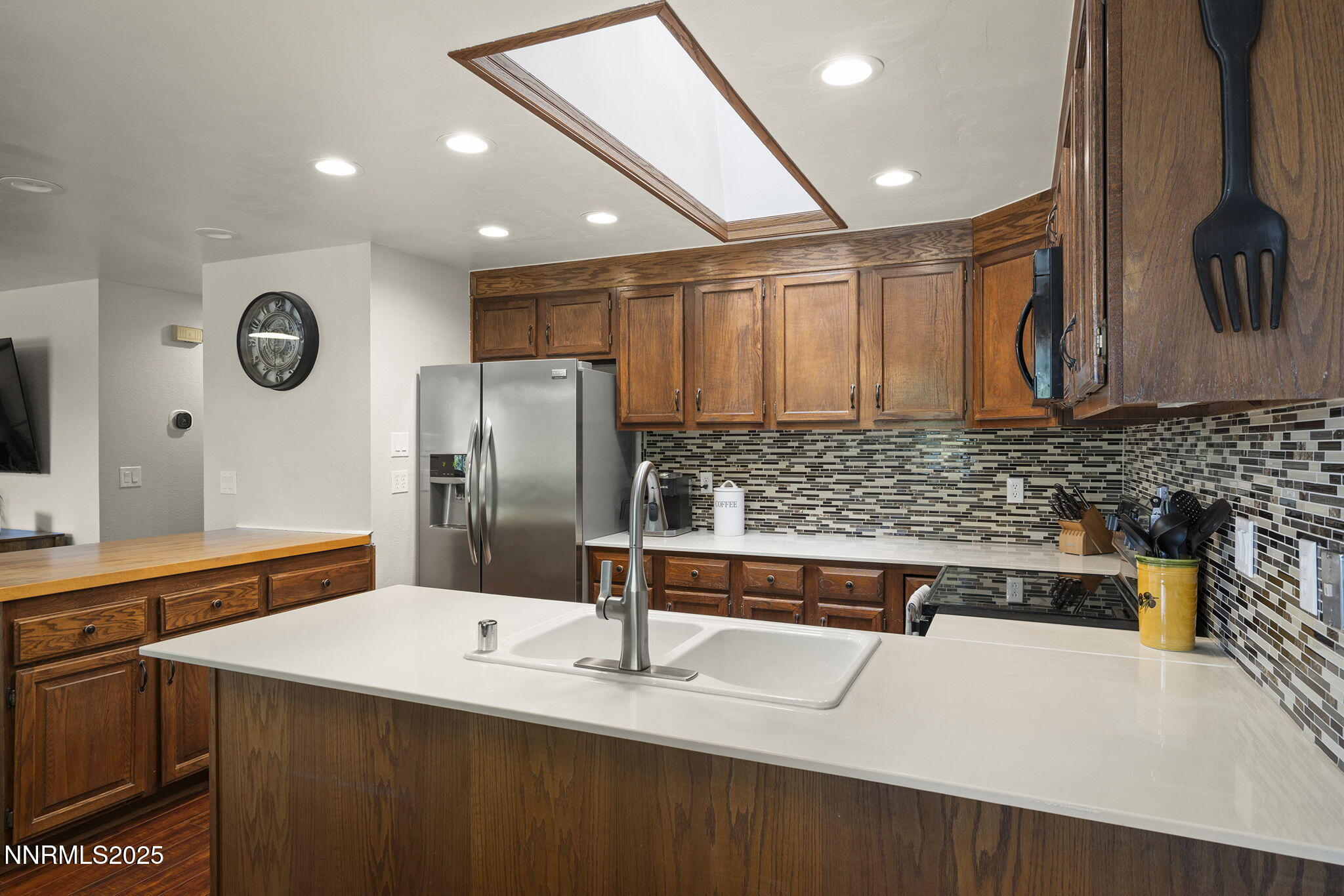 1080 Tudor Court Reno, NV 89503 - Photo 9 of 30 a kitchen with stainless steel appliances granite countertop a sink and a refrigerator