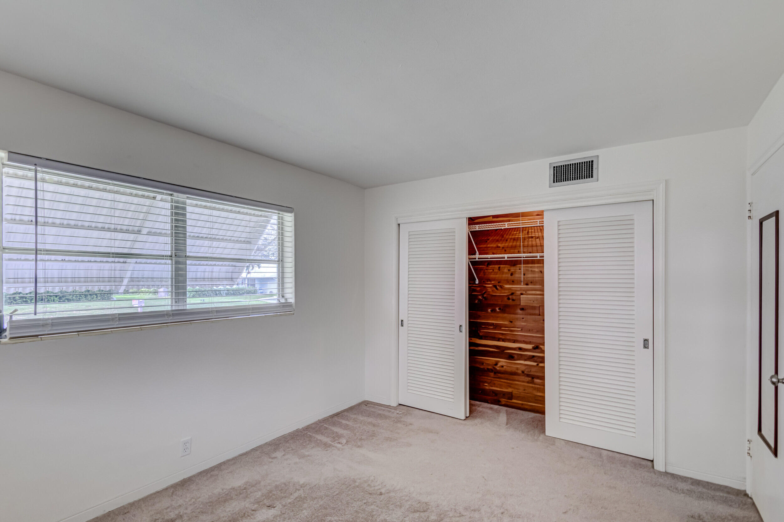 11170 Monet Ridge Road Palm Beach Gardens, FL 33410 - Photo 22 of 45 Guest Bedroom w/Cedar Closets