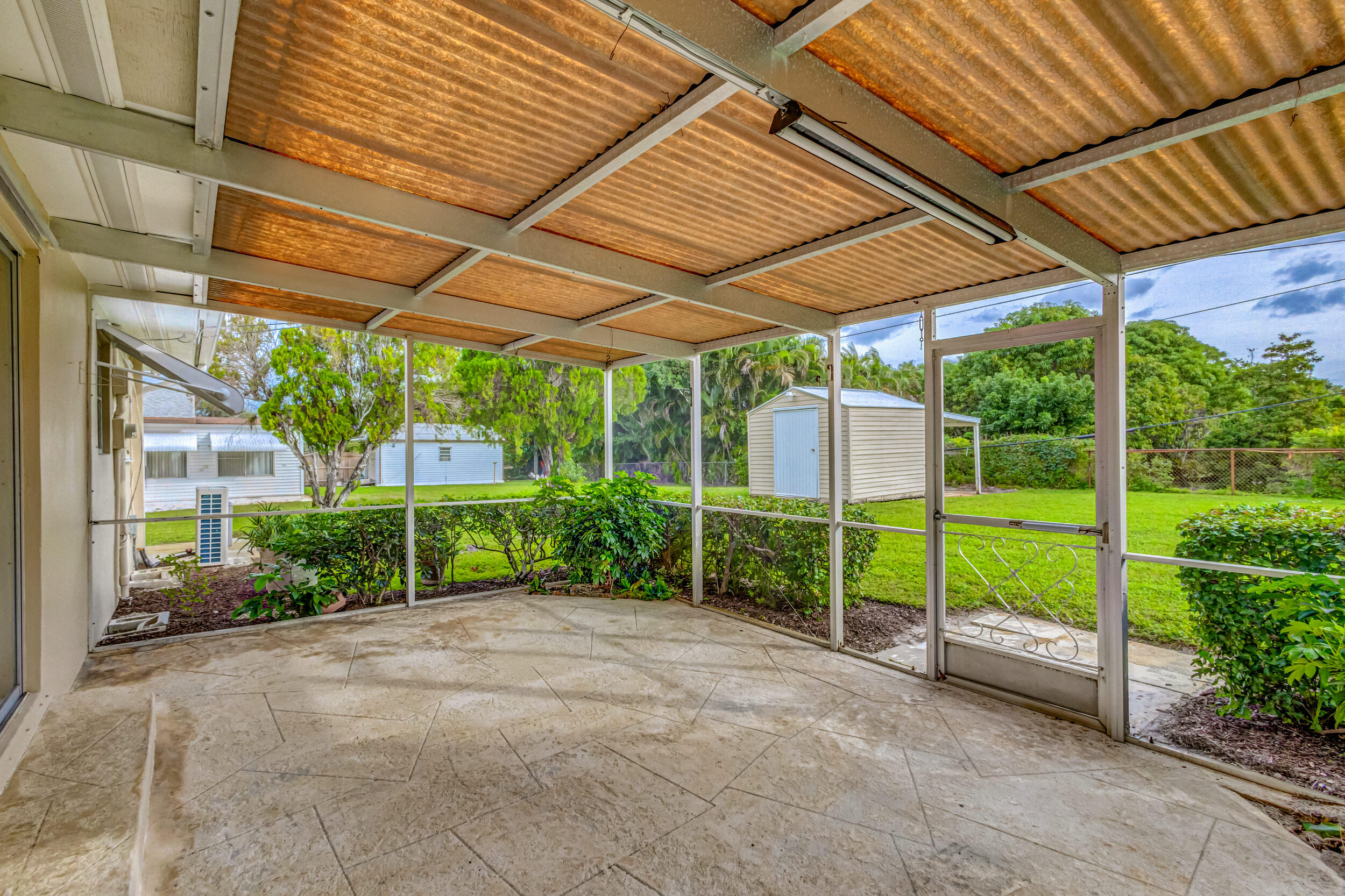 11170 Monet Ridge Road Palm Beach Gardens, FL 33410 - Photo 32 of 45 Back Patio