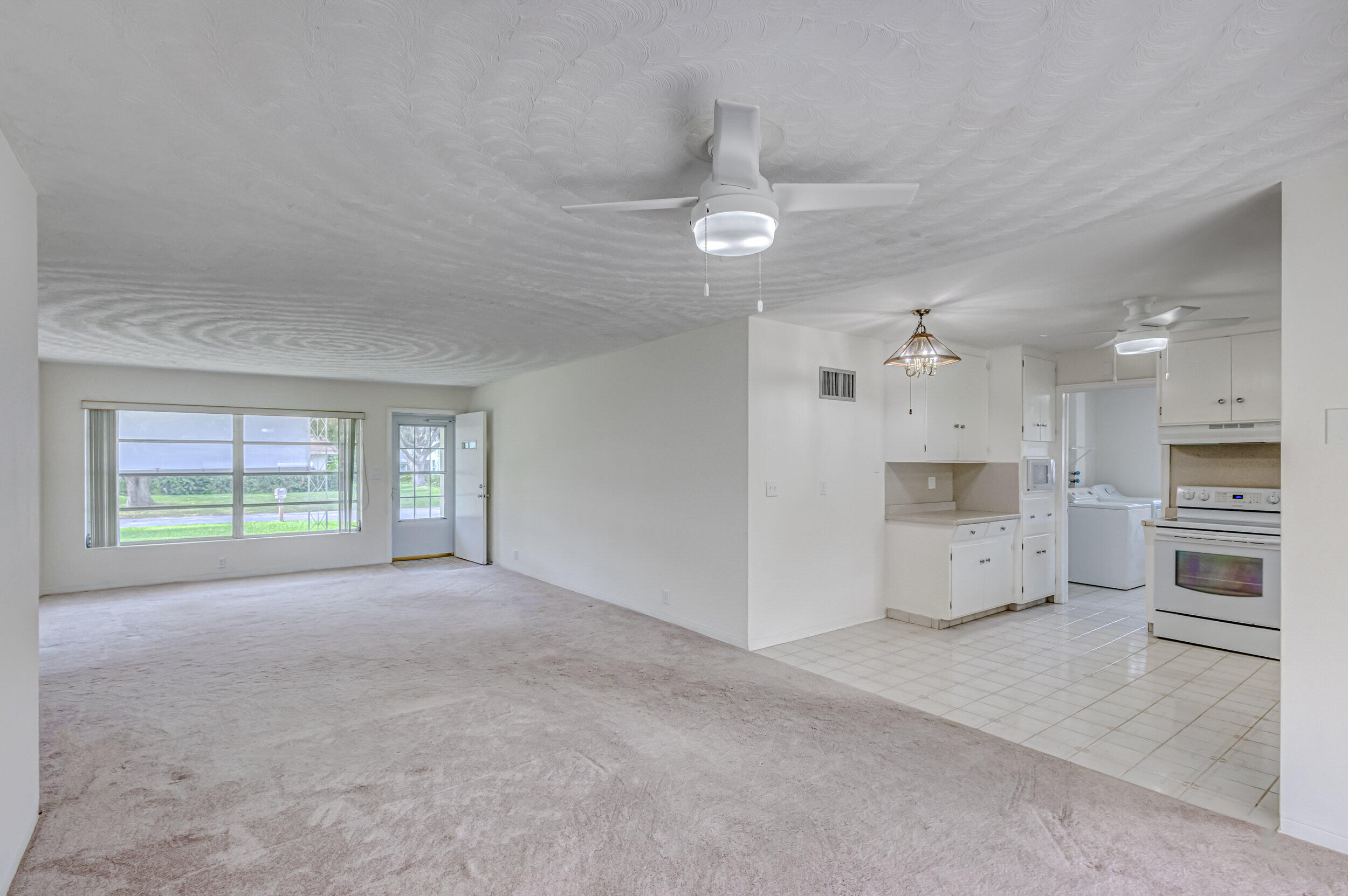 11170 Monet Ridge Road Palm Beach Gardens, FL 33410 - Photo 5 of 45 Living/Dining/Kitchen