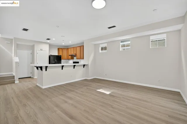 a view of kitchen with wooden floor and window
