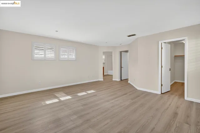 a view of a livingroom with wooden floor