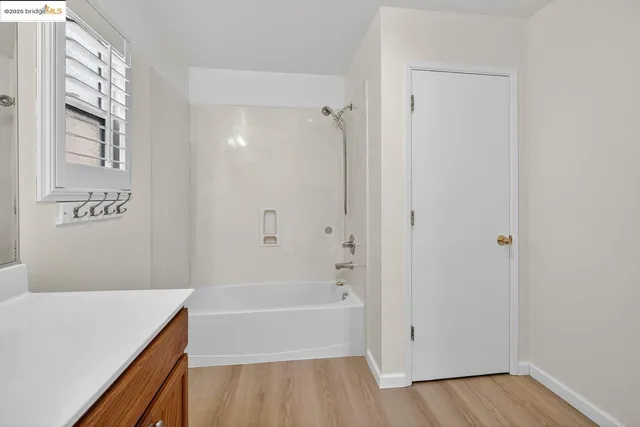 a bathroom with a bathtub and a sink