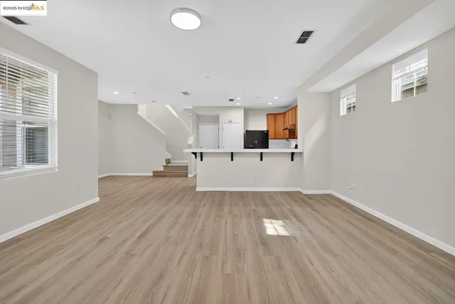 a view of kitchen and wooden floor