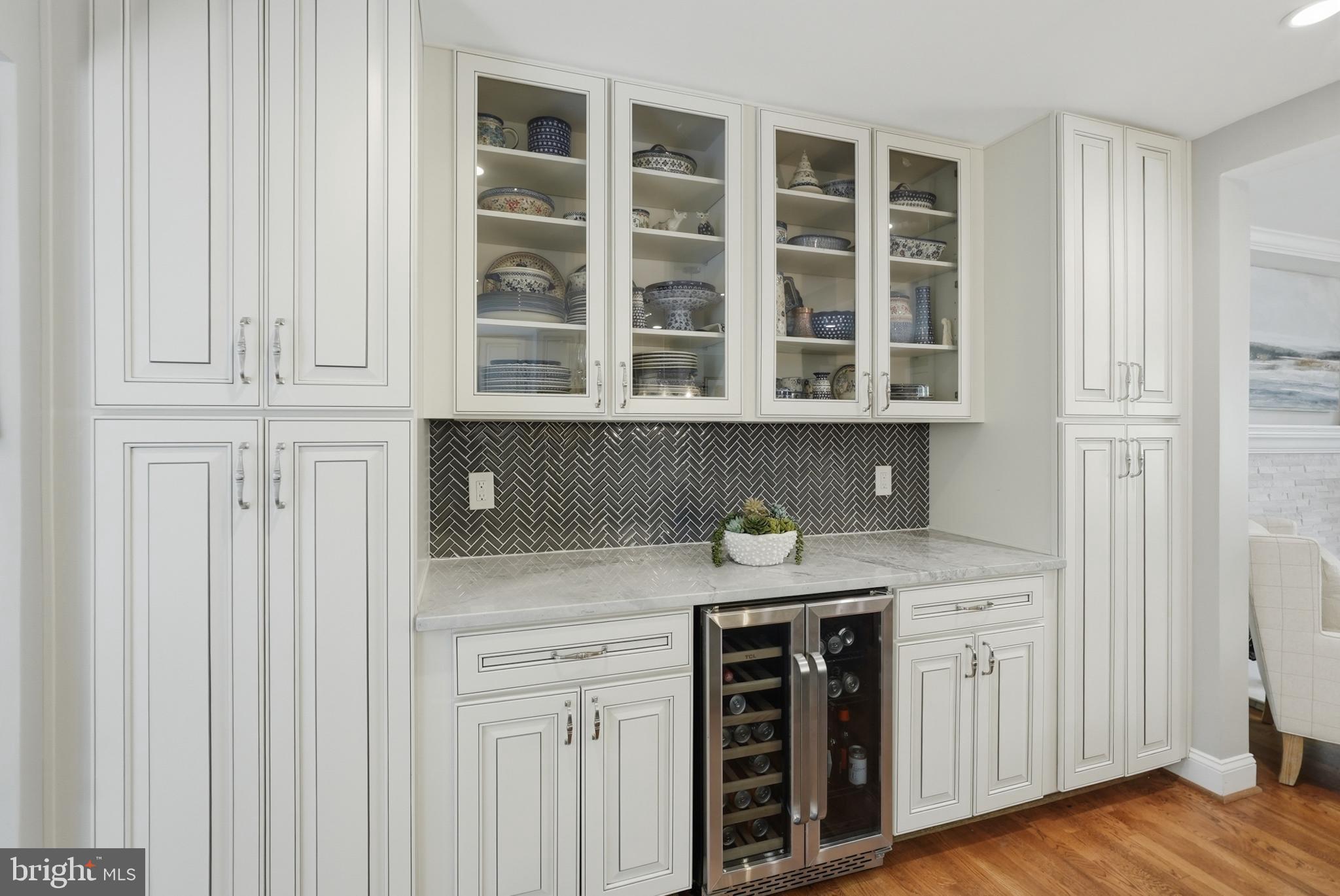 7006 Barnack Drive Springfield, VA 22152 - Photo 13 of 56 a kitchen with stainless steel appliances granite countertop white cabinets and a stove