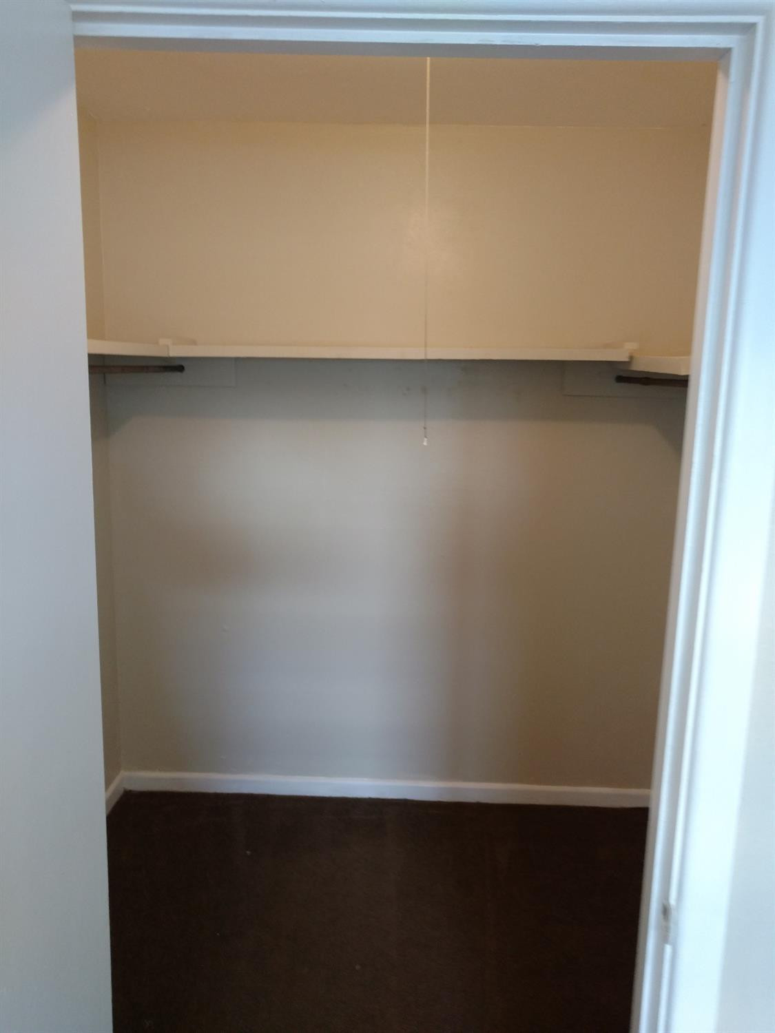 2812 43rd Street, Unit 6 Lubbock, TX 79413 - Photo 7 of 10 a view of a closet with wooden floor