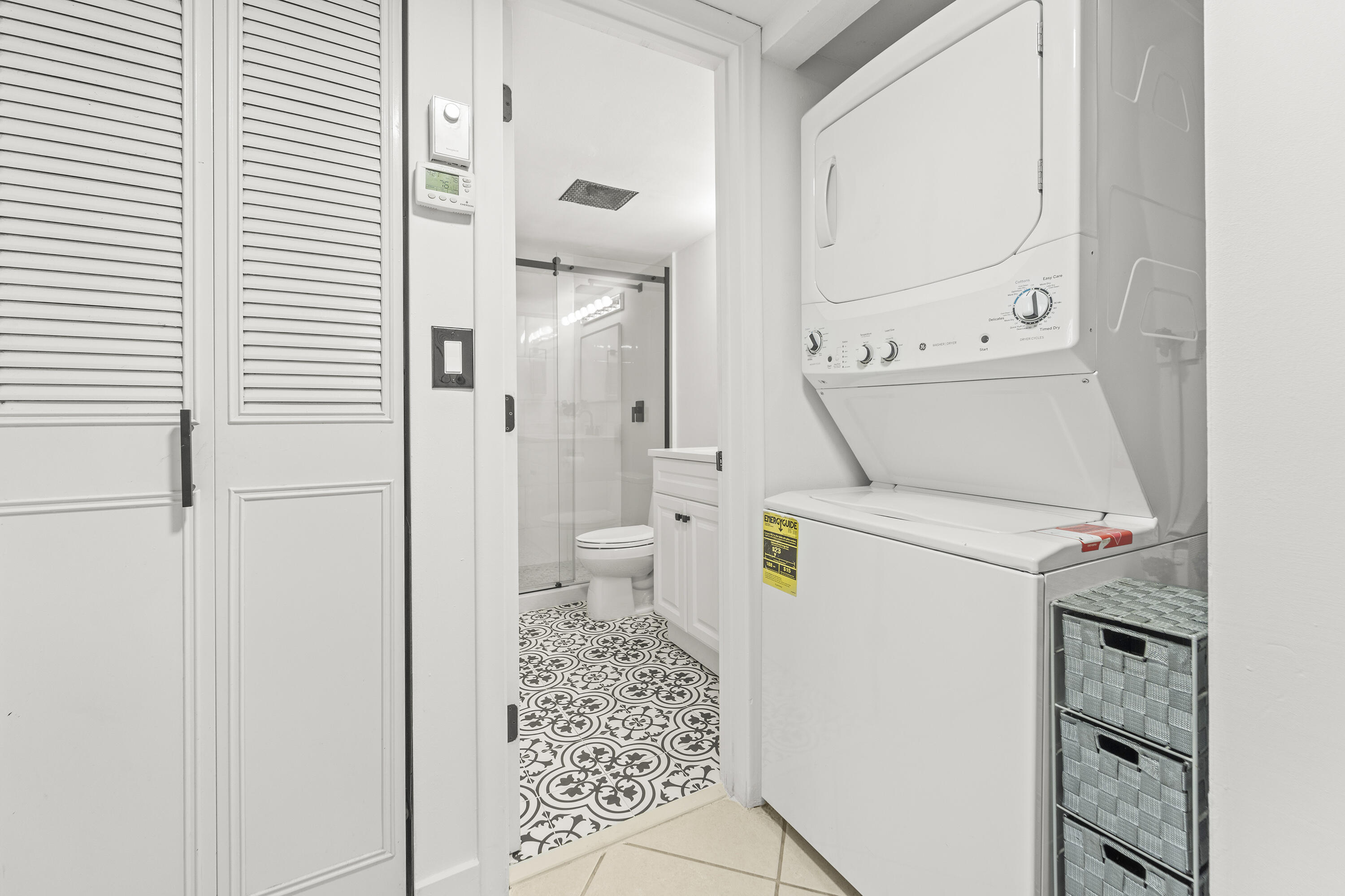 9500 Southwest 3rd Street, Unit 130 Boca Raton, FL 33428 - Photo 23 of 38 a bathroom with a toilet and a shower