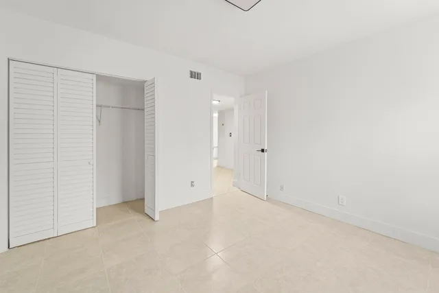 a view of a garden with lawn chairs