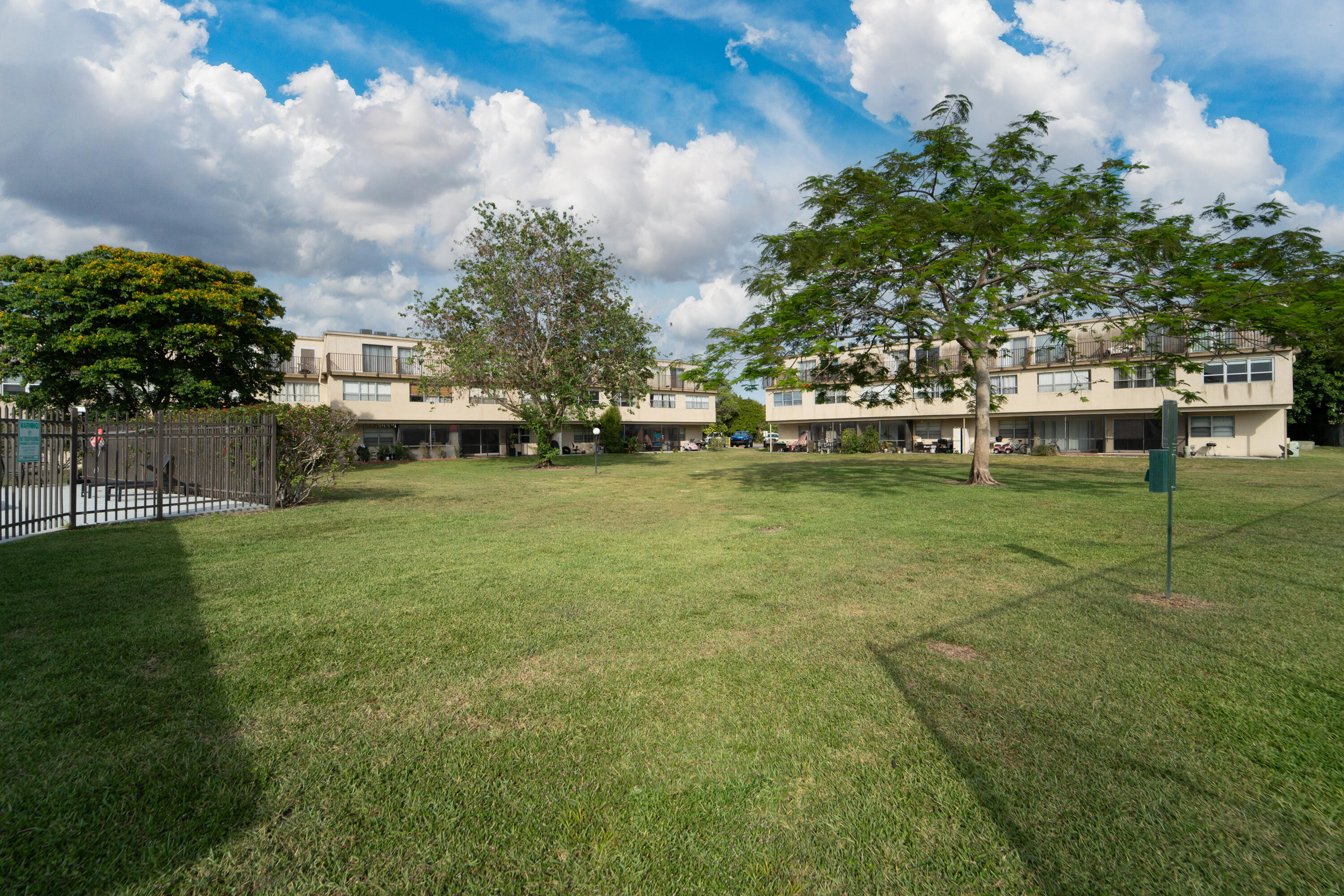 9500 Southwest 3rd Street, Unit 130 Boca Raton, FL 33428 - Photo 31 of 38 a view of a garden with lawn chairs