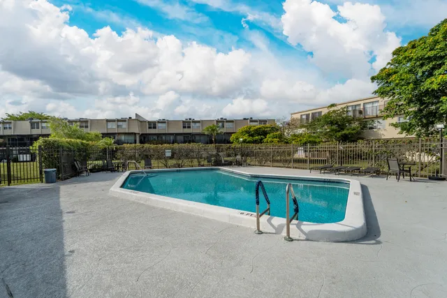 a view of a big yard with a fountain