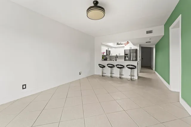a view of kitchen with furniture and chandelier