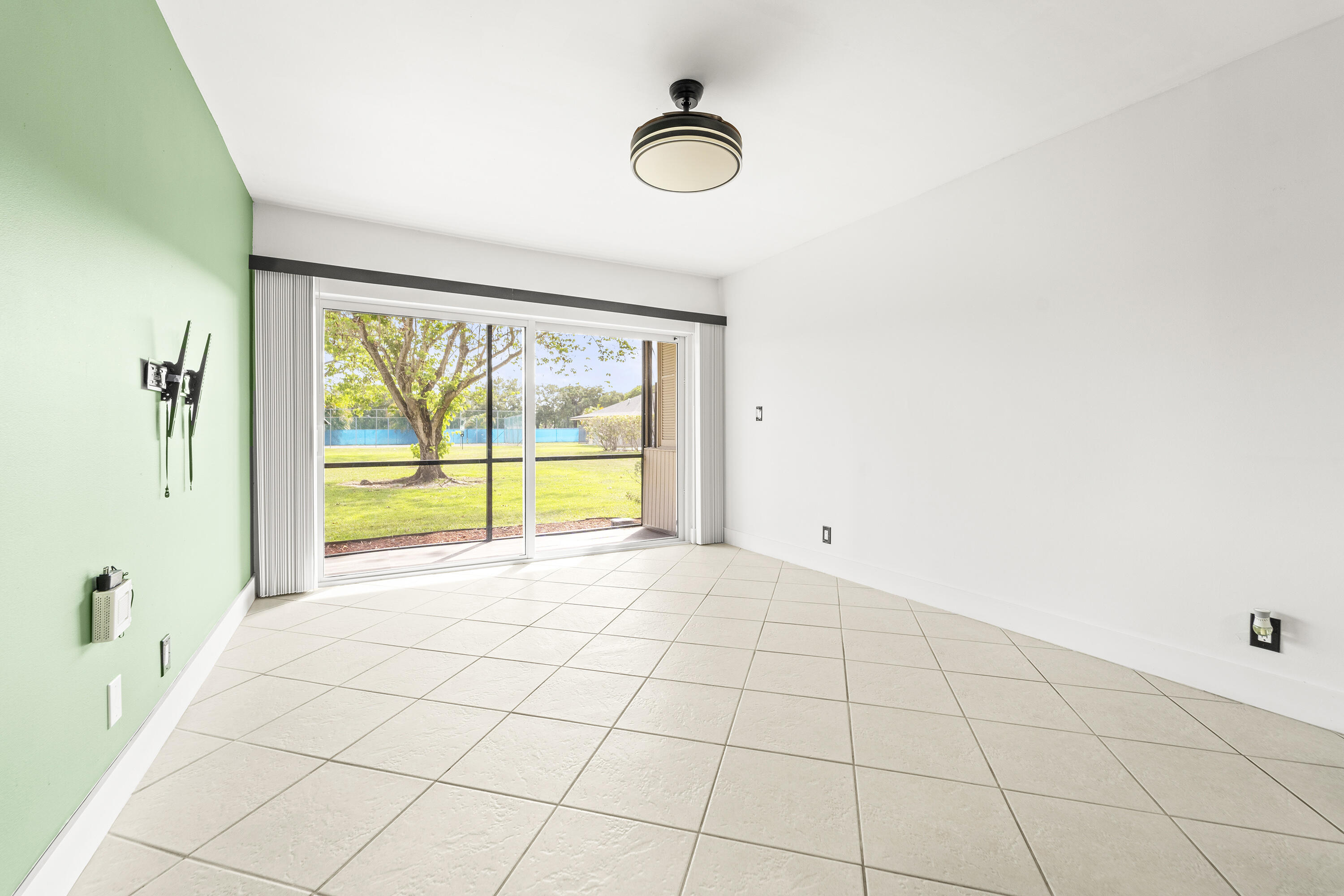 9500 Southwest 3rd Street, Unit 130 Boca Raton, FL 33428 - Photo 8 of 38 a view of an empty room and window