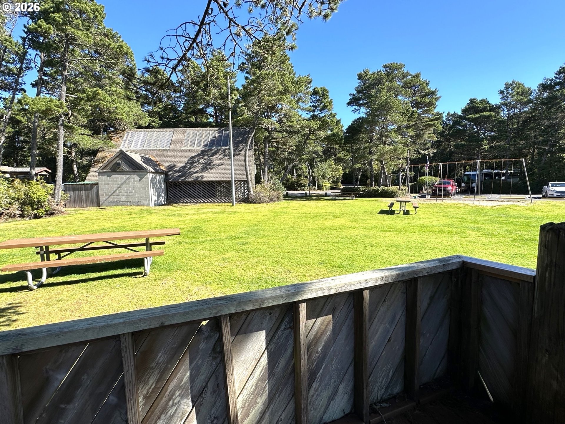 Sailors Ravine Court Florence, OR 97439 - Photo 15 of 18 a view of a swimming pool with a yard