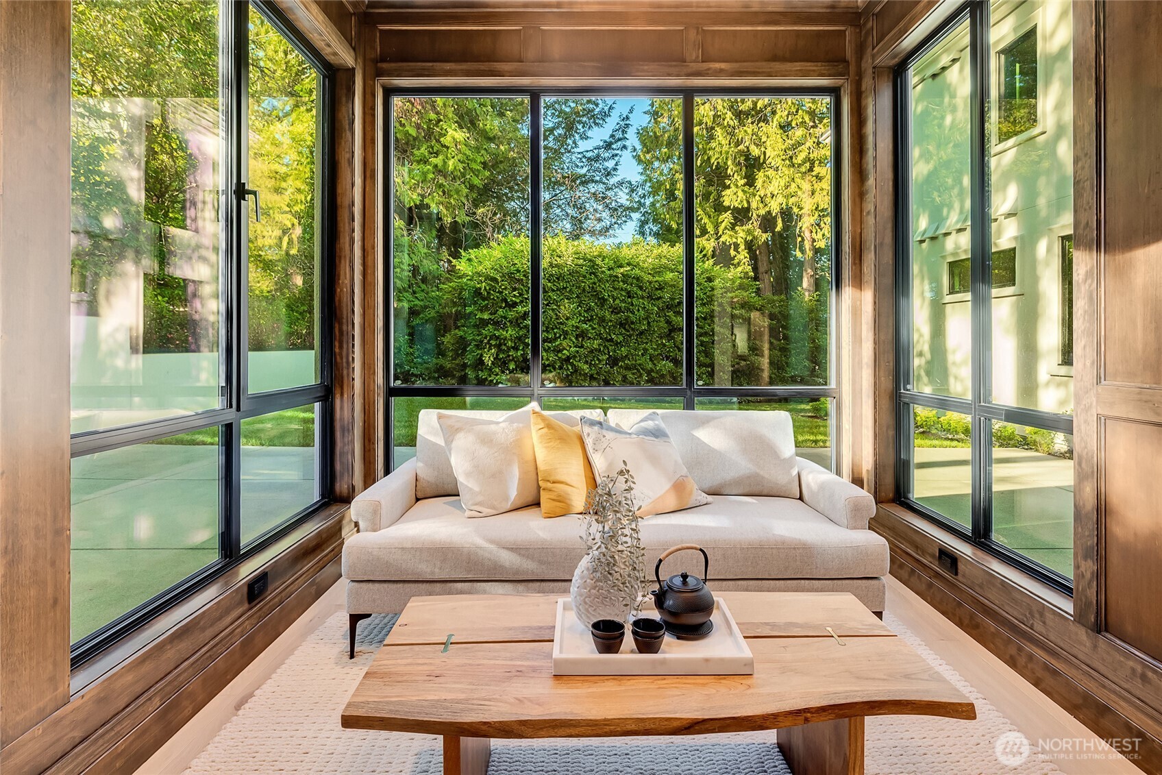 2837 Evergreen Point Road Medina, WA 98039 - Photo 16 of 39 a living room with large glass windows and a table