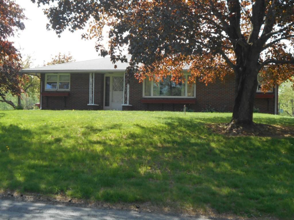 8 Grant Road Enfield, CT 06082 - Photo 1 of 1 a front view of a house with yard and tree