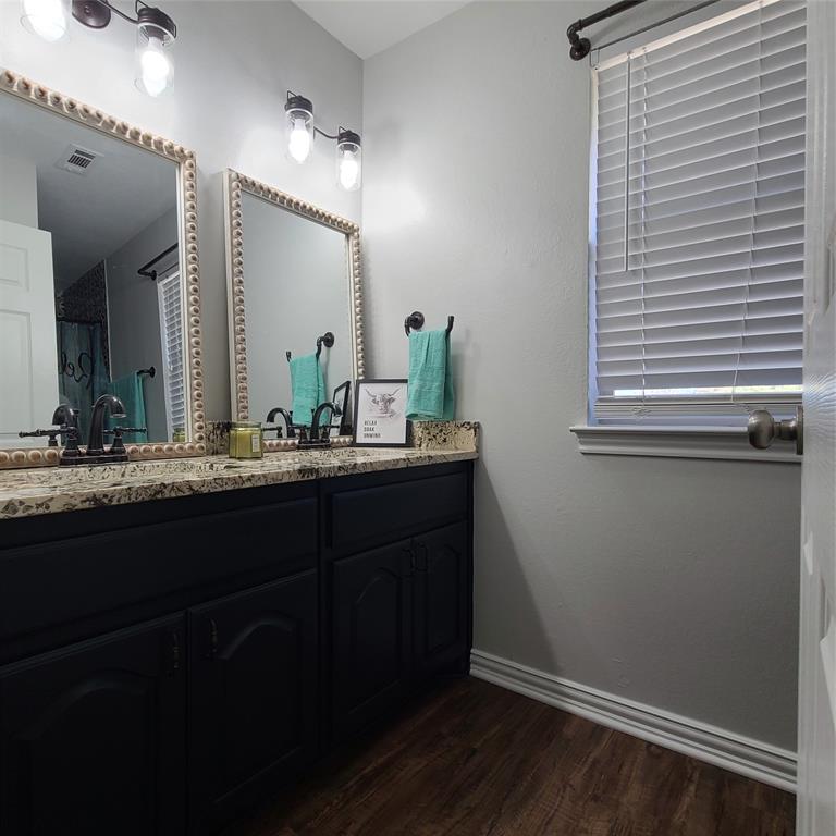 406 Epps Road Palmer, TX 75152 - Photo 11 of 36 a bathroom with a sink and a mirror