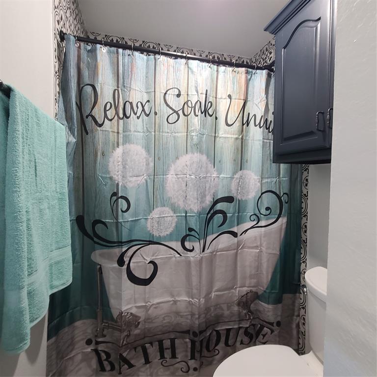 406 Epps Road Palmer, TX 75152 - Photo 12 of 36 a bathroom with a granite countertop sink and a mirror
