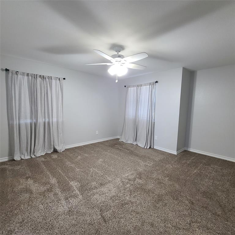 406 Epps Road Palmer, TX 75152 - Photo 14 of 36 an empty room with chandelier fan