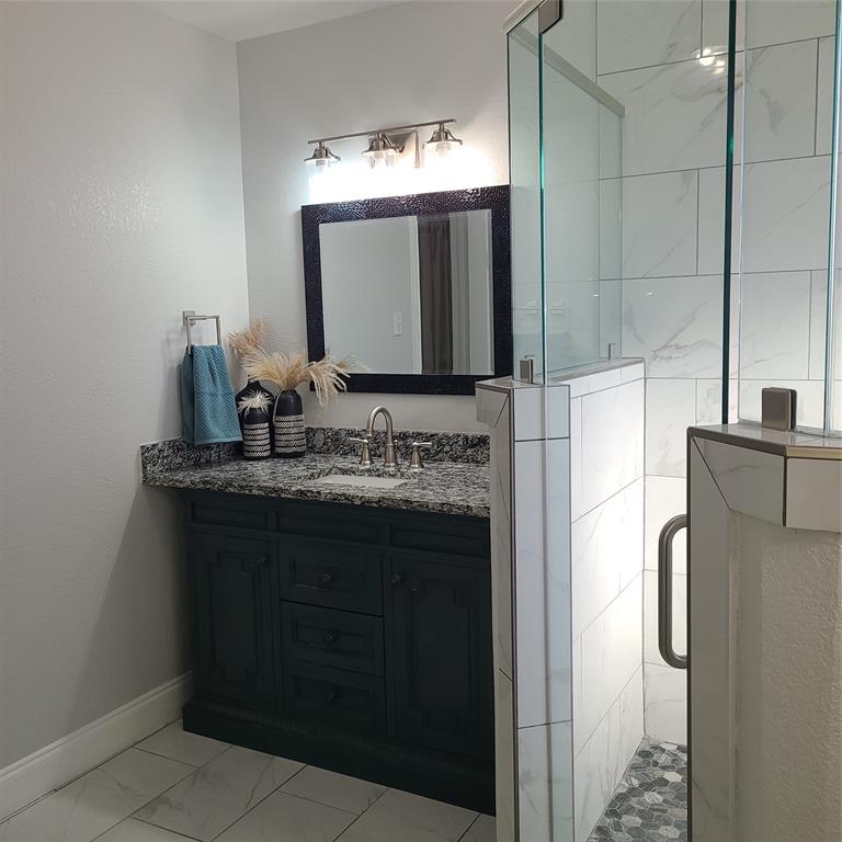 406 Epps Road Palmer, TX 75152 - Photo 17 of 36 a bathroom with a sink and a mirror
