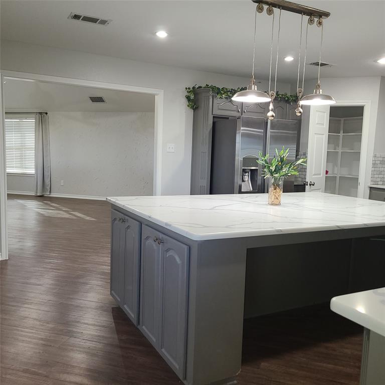 406 Epps Road Palmer, TX 75152 - Photo 8 of 36 a kitchen with stainless steel appliances granite countertop a sink and wooden floor